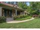 Close-up of front entrance with stone accents, detailed door, and lush landscaping at 351 Old Orchard Ct, Marietta, GA 30068