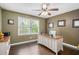 A well lit office area features a ceiling fan and beautiful hardwood floors at 351 Old Orchard Ct, Marietta, GA 30068