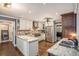 Modern kitchen with stainless steel appliances, granite countertops, hardwood floors, and ample cabinet space at 351 Old Orchard Ct, Marietta, GA 30068