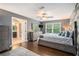 Beautifully decorated bedroom with hardwood floors and a large window overlooking the trees at 351 Old Orchard Ct, Marietta, GA 30068