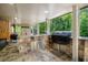 Covered outdoor kitchen with stone facade, built-in grill, and ample counter space for entertaining at 351 Old Orchard Ct, Marietta, GA 30068