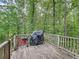 Back deck with a grill and other outdoor items that create an inviting space for gatherings at 505 Blake Dr, Douglasville, GA 30134