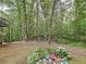 Backyard with small birdbath and plant garden showing the natural and peaceful outdoor space at 505 Blake Dr, Douglasville, GA 30134