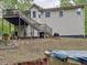 Backyard view featuring the upper deck, stairs, and lower yard, highlighting the property's outdoor space at 505 Blake Dr, Douglasville, GA 30134