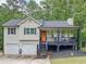 Charming two-story home featuring a cozy front porch, well-maintained landscaping, and an inviting entrance at 505 Blake Dr, Douglasville, GA 30134