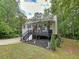 Inviting two-story home with a charming front porch, set amongst mature trees, and a neatly landscaped yard at 505 Blake Dr, Douglasville, GA 30134