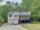 Charming front exterior with a well-manicured lawn, covered porch, attached garage, and inviting curb appeal at 505 Blake Dr, Douglasville, GA 30134