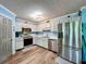 Modern kitchen featuring stainless steel appliances, ample counter space, and stylish gray cabinets at 505 Blake Dr, Douglasville, GA 30134