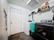 Functional laundry room featuring modern washer and dryer, storage shelves, and convenient access to the rest of the home at 505 Blake Dr, Douglasville, GA 30134
