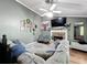 Comfortable living room with a fireplace, large sectional sofa, and decor, perfect for relaxation and entertainment at 505 Blake Dr, Douglasville, GA 30134