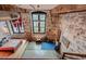 Spacious bedroom with exposed brick wall, large window and industrial chic design at 170 Boulevard # H201, Atlanta, GA 30312