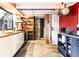 Modern kitchen featuring sleek countertops, stainless steel appliances, and brick accent wall at 170 Boulevard # H201, Atlanta, GA 30312