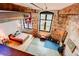 Upstairs loft showing living area with brick walls, high ceilings, and exposed duct work at 170 Boulevard # H201, Atlanta, GA 30312