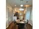 Cozy dining area with modern lighting fixture, perfect for entertaining guests or Gathering dinners at 1740 Emerald Ave Ave, Atlanta, GA 30310
