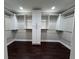 Spacious walk-in closet features custom shelving and dark wood flooring at 1740 Emerald Ave Ave, Atlanta, GA 30310