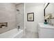 Bathroom with a bathtub, tiled walls, and a white vanity at 3226 Custer Lake Nw Dr, Marietta, GA 30064
