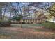 Charming single-story home with mature trees and a well-maintained lawn at 3226 Custer Lake Nw Dr, Marietta, GA 30064
