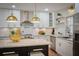Bright kitchen featuring custom cabinets, granite countertops, a kitchen island and stainless steel appliances at 3226 Custer Lake Nw Dr, Marietta, GA 30064