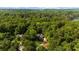 Stunning aerial view of a home surrounded by dense forest and greenery at 3445 Strawberry Ln, Cumming, GA 30041