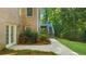 Brick house exterior features a manicured lawn and a spacious back deck with stairs leading down to the backyard at 3445 Strawberry Ln, Cumming, GA 30041