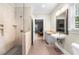 Modern bathroom featuring a glass-enclosed shower and sleek vanity with granite countertop at 3445 Strawberry Ln, Cumming, GA 30041