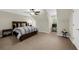 Spacious bedroom featuring vaulted ceilings, a large bed, and ample natural light, creating a comfortable and inviting retreat at 3445 Strawberry Ln, Cumming, GA 30041