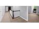 Bright upstairs hallway with neutral carpets offering a view to an adjacent living space at 3445 Strawberry Ln, Cumming, GA 30041