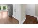This hallway includes plenty of storage space and stainless steel appliances at 3445 Strawberry Ln, Cumming, GA 30041