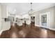 Large kitchen featuring a kitchen island, stainless steel appliances, and access to the outdoor living space at 3445 Strawberry Ln, Cumming, GA 30041