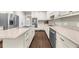 Modern kitchen with stainless steel appliances, light countertops and white cabinetry at 3445 Strawberry Ln, Cumming, GA 30041