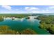 Scenic aerial view of a tranquil lake surrounded by islands and forests at 3445 Strawberry Ln, Cumming, GA 30041