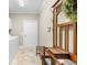 Functional laundry room with wooden accents and a convenient bench with coat hooks at 3445 Strawberry Ln, Cumming, GA 30041