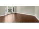 This living room features a large bay window and hardwood flooring at 3445 Strawberry Ln, Cumming, GA 30041