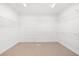 Spacious walk-in closet with plenty of shelving and storage space to keep your wardrobe organized and accessible at 3445 Strawberry Ln, Cumming, GA 30041