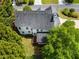 Aerial view of the home showing a well maintained roof, lush landscaping and serene backyard at 1552 Brentwood Dr, Marietta, GA 30062