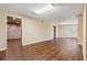 Finished basement with dark wood floors, neutral walls, and an exit to the outside at 1552 Brentwood Dr, Marietta, GA 30062