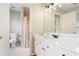 Bathroom featuring a sleek vanity, modern fixtures, and a view to the shower and toilet at 1552 Brentwood Dr, Marietta, GA 30062