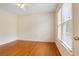 Bright bedroom with hardwood floors, a ceiling fan, and a double window at 1552 Brentwood Dr, Marietta, GA 30062