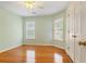 Bedroom with two windows for natural light, hardwood floors and closet at 1552 Brentwood Dr, Marietta, GA 30062