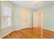 Bedroom with hardwood floors, two windows for natural light and a closet at 1552 Brentwood Dr, Marietta, GA 30062