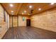 Bonus room with wood paneling, wood floors and a ceiling fan at 1552 Brentwood Dr, Marietta, GA 30062