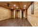 Bonus room with wood paneling, wood floors, recessed lighting and a ceiling fan at 1552 Brentwood Dr, Marietta, GA 30062