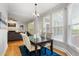 Cozy dining area with natural light, seamlessly connecting to a comfortable living space at 1552 Brentwood Dr, Marietta, GA 30062