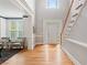 Grand foyer with hardwood floors, a staircase, and view to a living room area with lots of light at 1552 Brentwood Dr, Marietta, GA 30062
