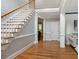 Elegant foyer featuring hardwood floors, a staircase with white railing, and classic architectural details at 1552 Brentwood Dr, Marietta, GA 30062