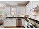 Well-lit kitchen with sleek countertops, stainless steel appliances, and modern cabinetry at 1552 Brentwood Dr, Marietta, GA 30062