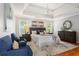 Spacious main bedroom showcasing a tray ceiling, dark furniture, and natural light at 1552 Brentwood Dr, Marietta, GA 30062