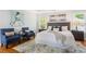 Serene main bedroom with a tray ceiling, two side chairs, and natural light at 1552 Brentwood Dr, Marietta, GA 30062