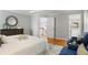 Spacious main bedroom with a view of the stairs and entry to the main bathroom at 1552 Brentwood Dr, Marietta, GA 30062