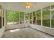 Enjoy outdoor living in this screened porch with views of the backyard and neighborhood at 1552 Brentwood Dr, Marietta, GA 30062